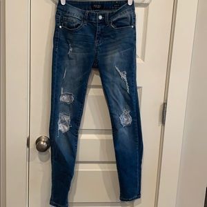 skinny fit ripped jeans with fabric patches